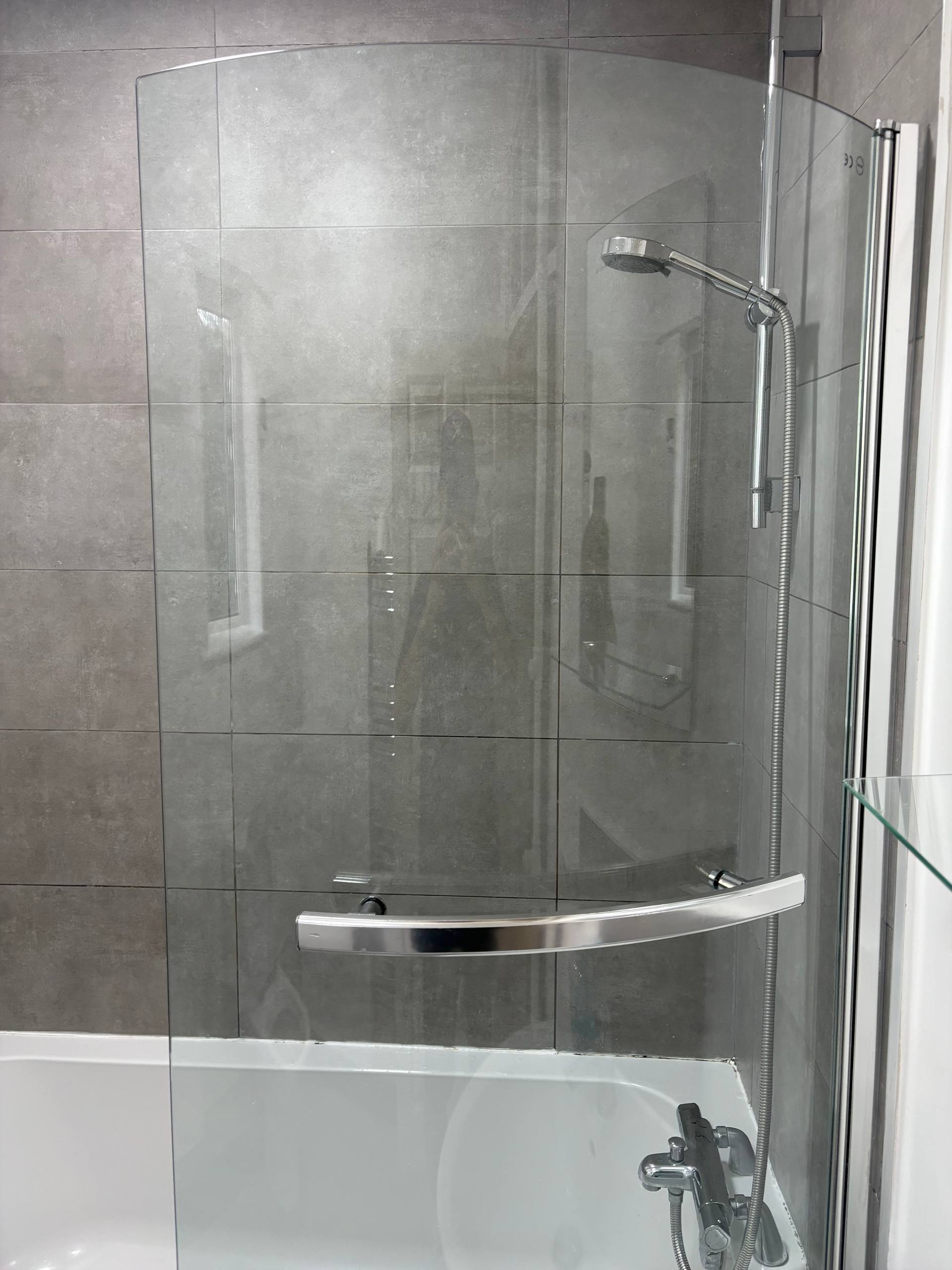 Shower screen and fittings photographed after cleaning