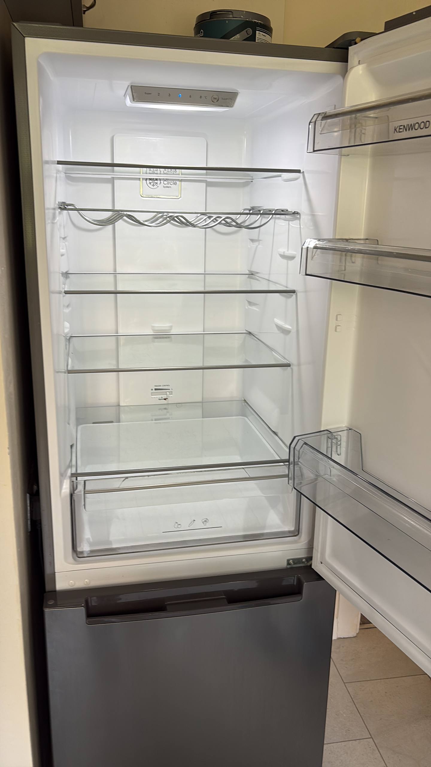 Empty fridge interior photographed after cleaning
